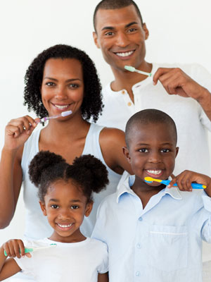 family brushing teeth